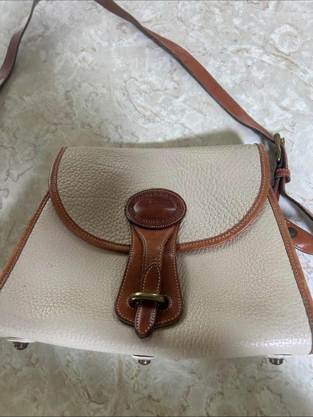 Dooney & Bourke Cream and Brown Pebbled Leather Crossbody Saddle Bag